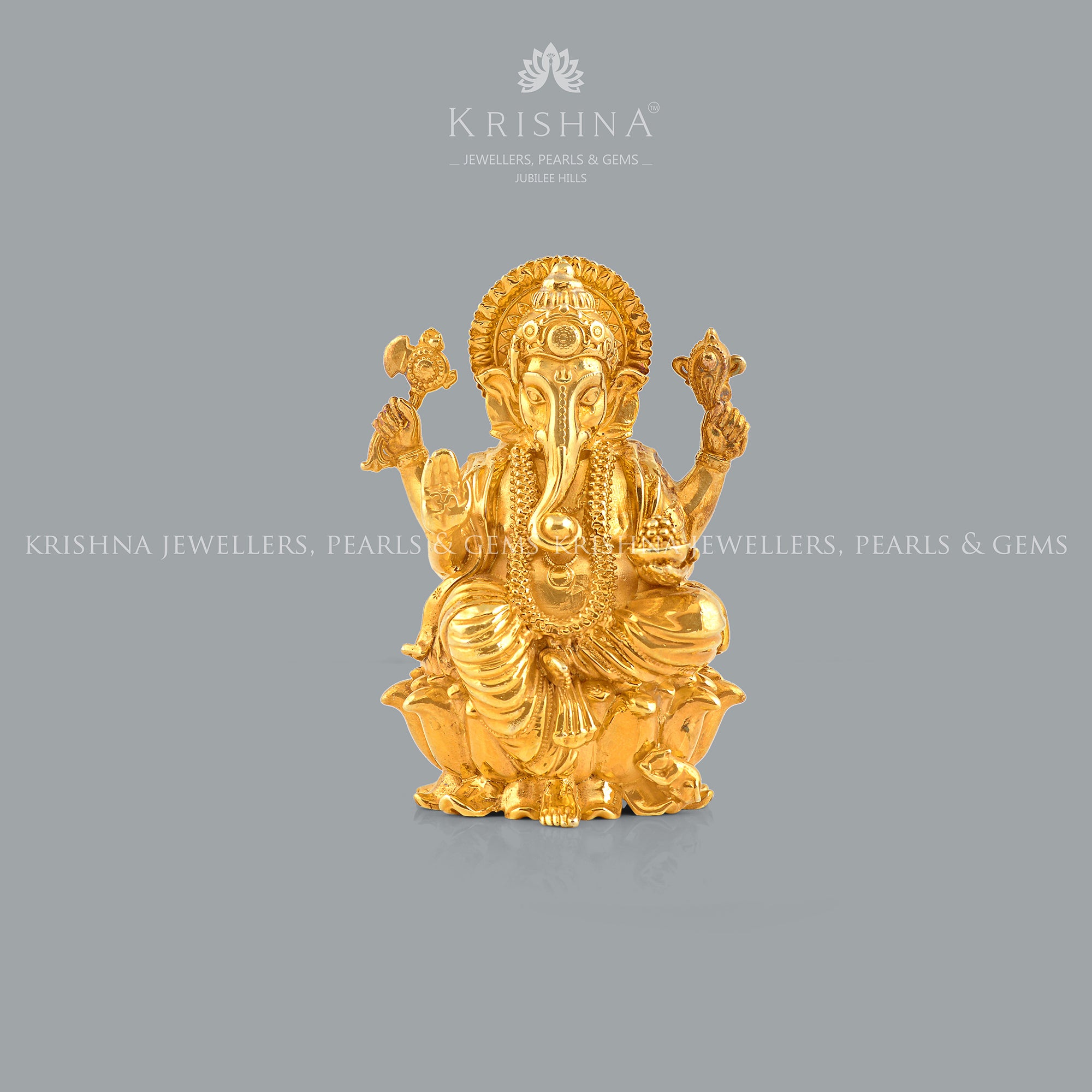 Silver Ganesh Idol in Golden Elegance
