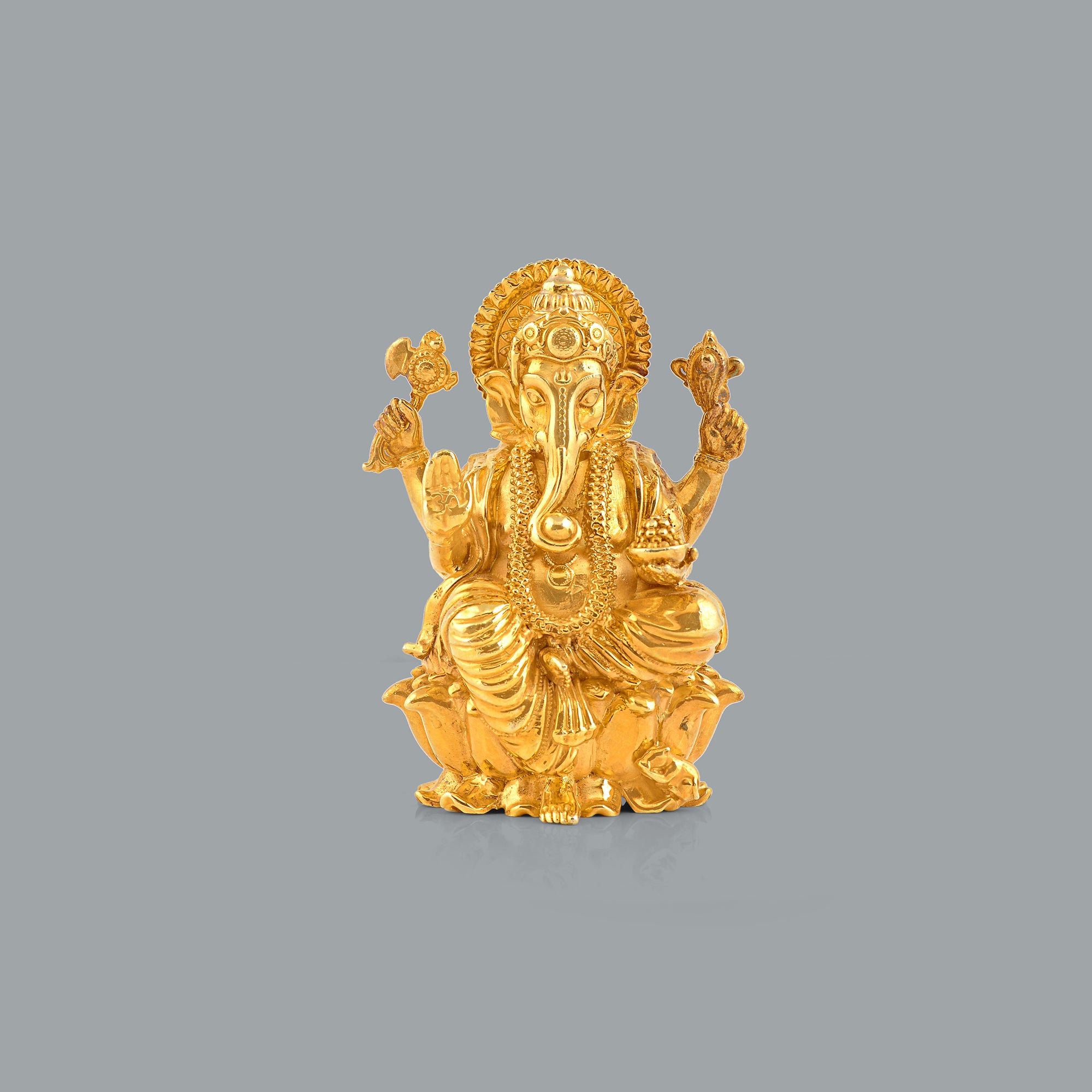 Silver Ganesh Idol in Golden Elegance - Krishna Jewellers Pearls and Gems