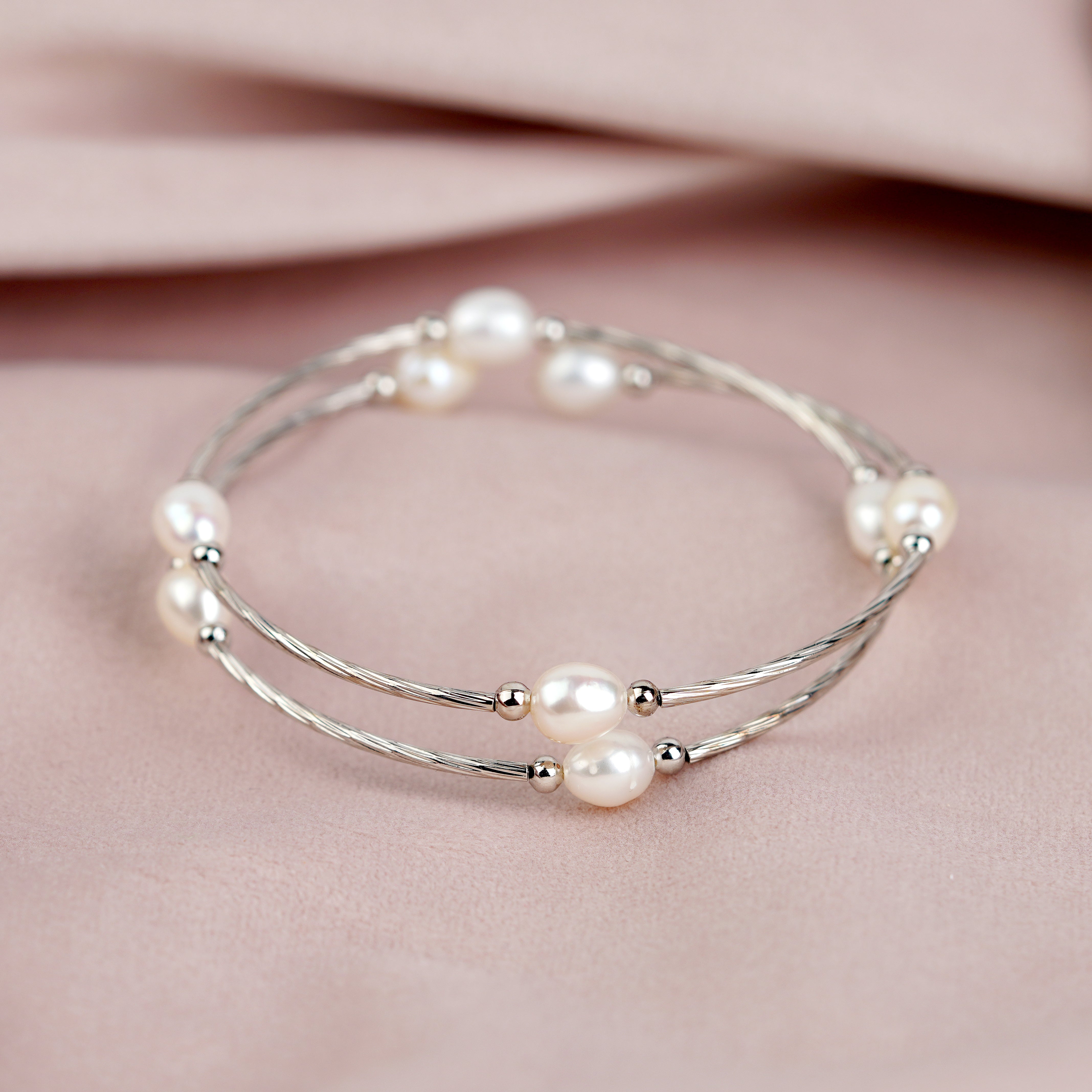 A bracelet adorned with white pearls - Krishna Jewellers Pearls and Gems