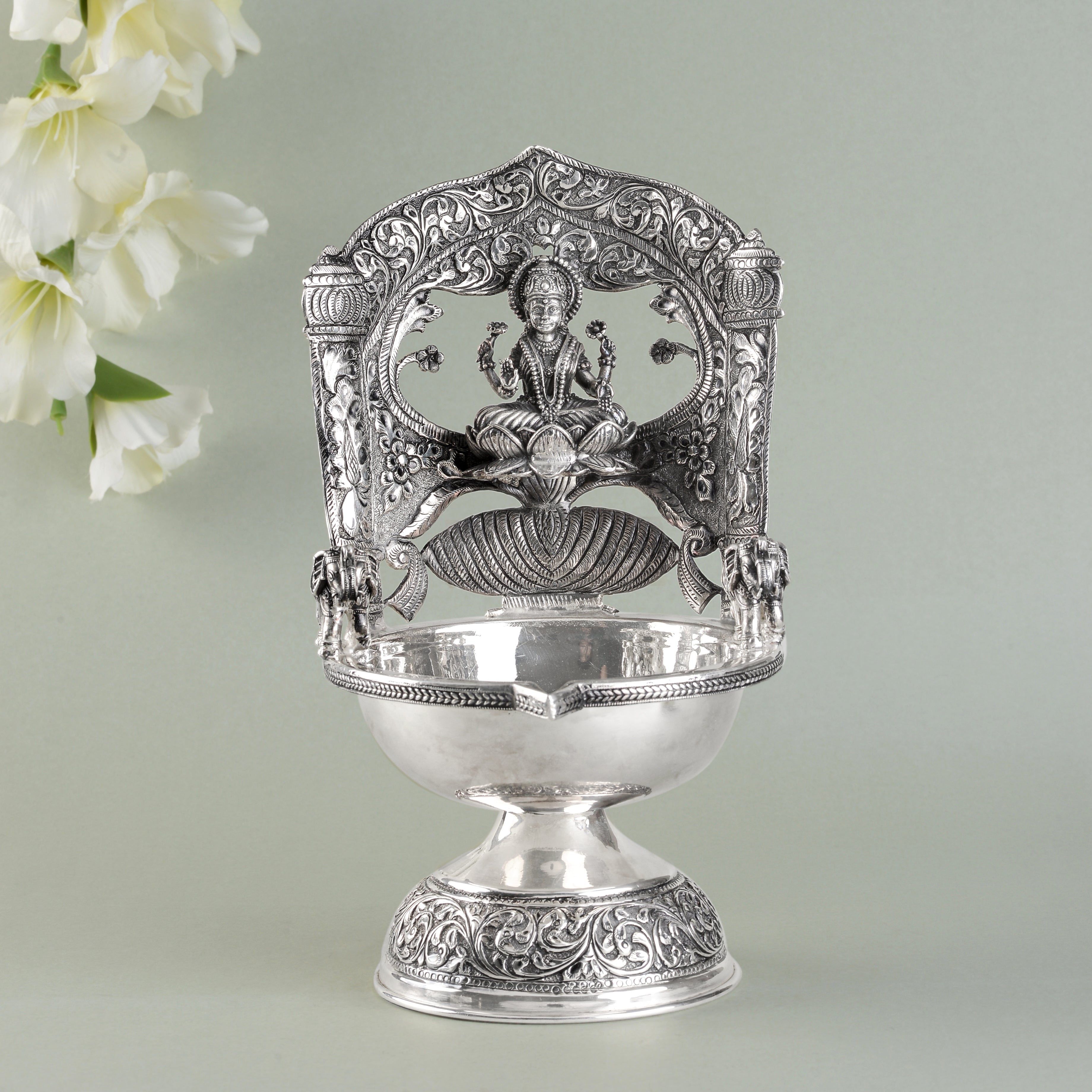 Lakshmi devi floral silver diya.