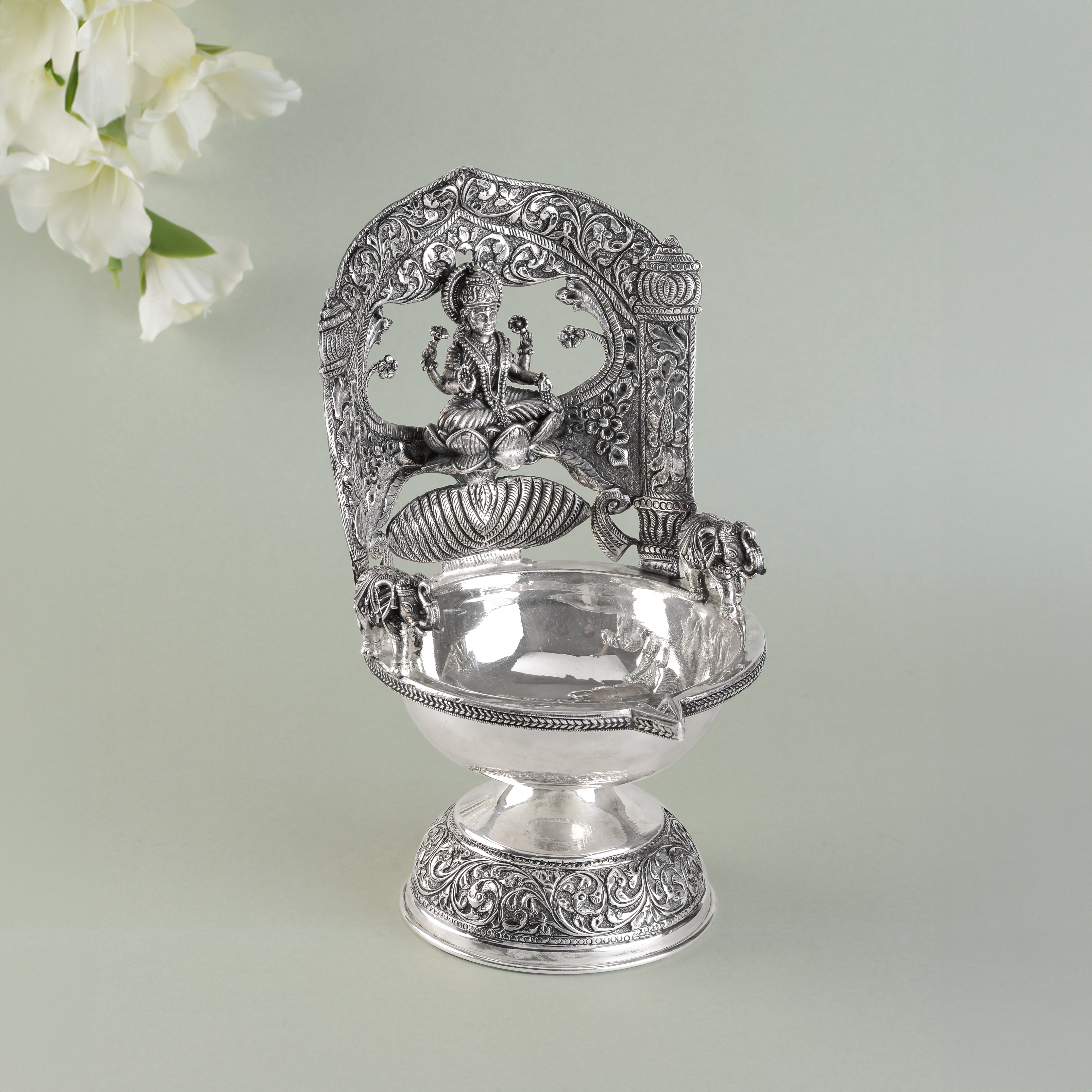 Lakshmi devi floral silver diya.