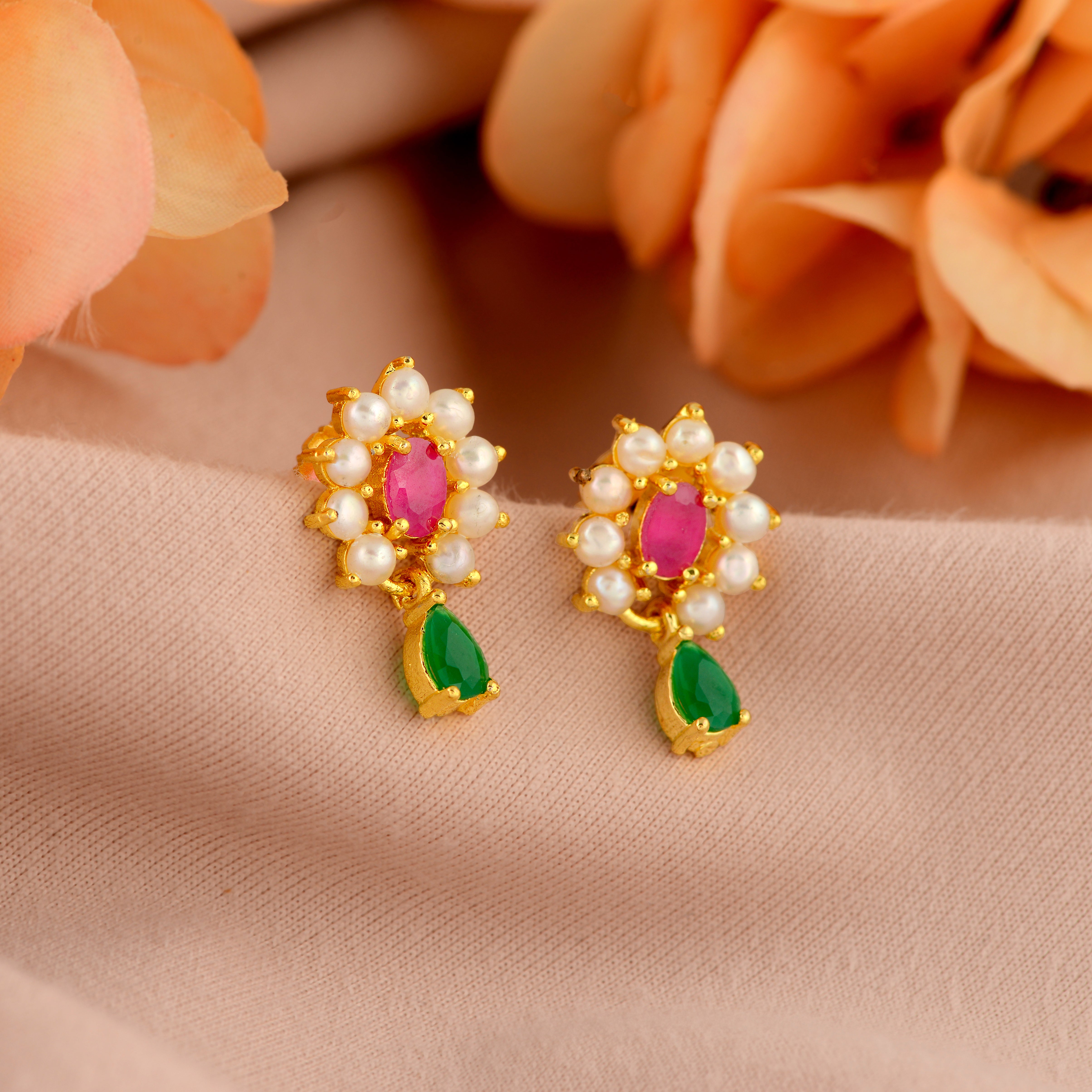 Gold-plated flower studs with pearls.