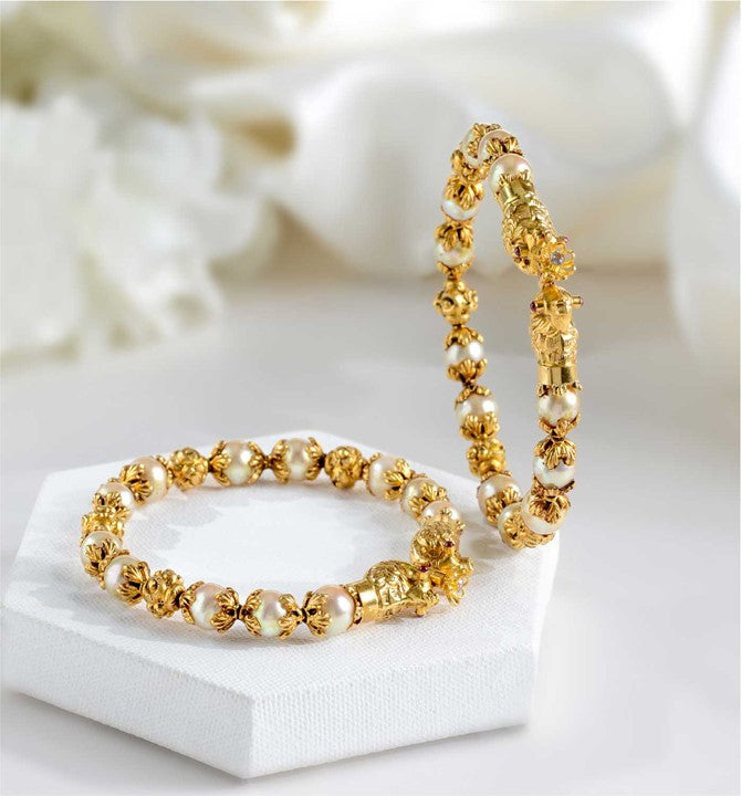 Gold Pearl Bangles in Nakshi work