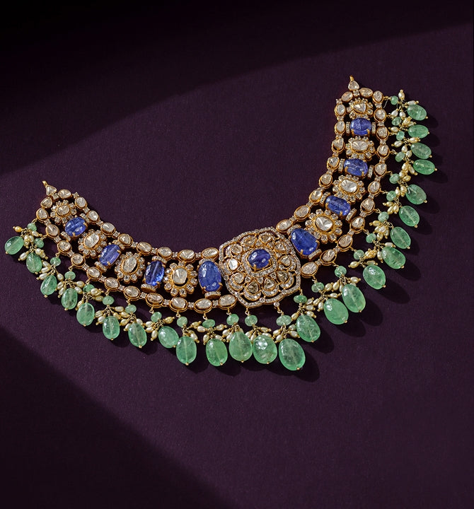 Queenly Polki choker with emerald and Tanzanite
