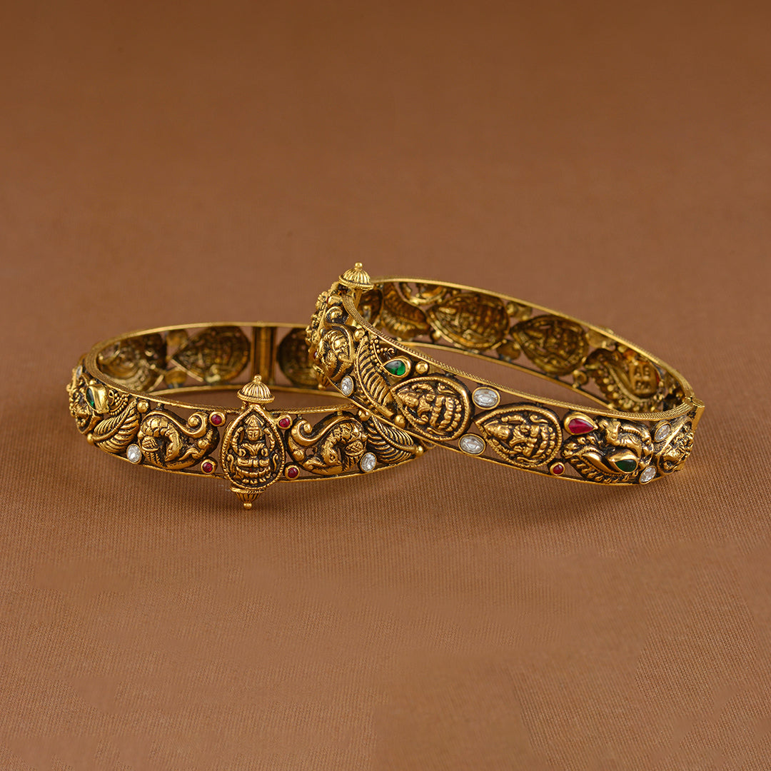 Antique Gold Bangles With Lakshmi And Peacock Motif