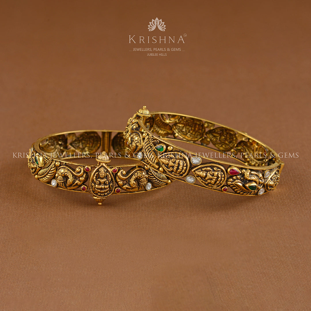 Antique Gold Bangles With Lakshmi And Peacock Motif